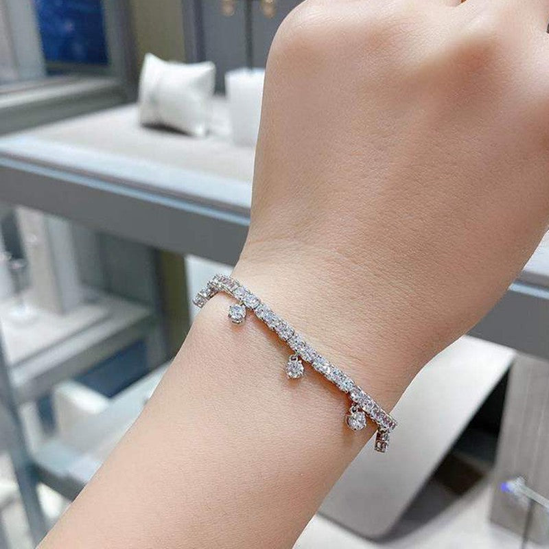 PULSERA SWAROVSKI TENIS SUBTLE DROP CRISTALES PLATEADA + KIT DE REGALO