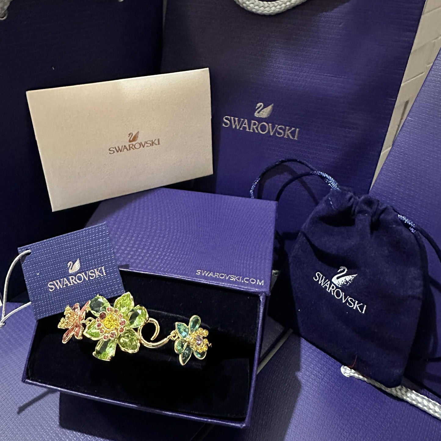PULSERA BRAZALETE SWAROVSKI IDYLLIA CRISTALES FLOR MULTI COLOR DORADO + KIT DE REGALO
